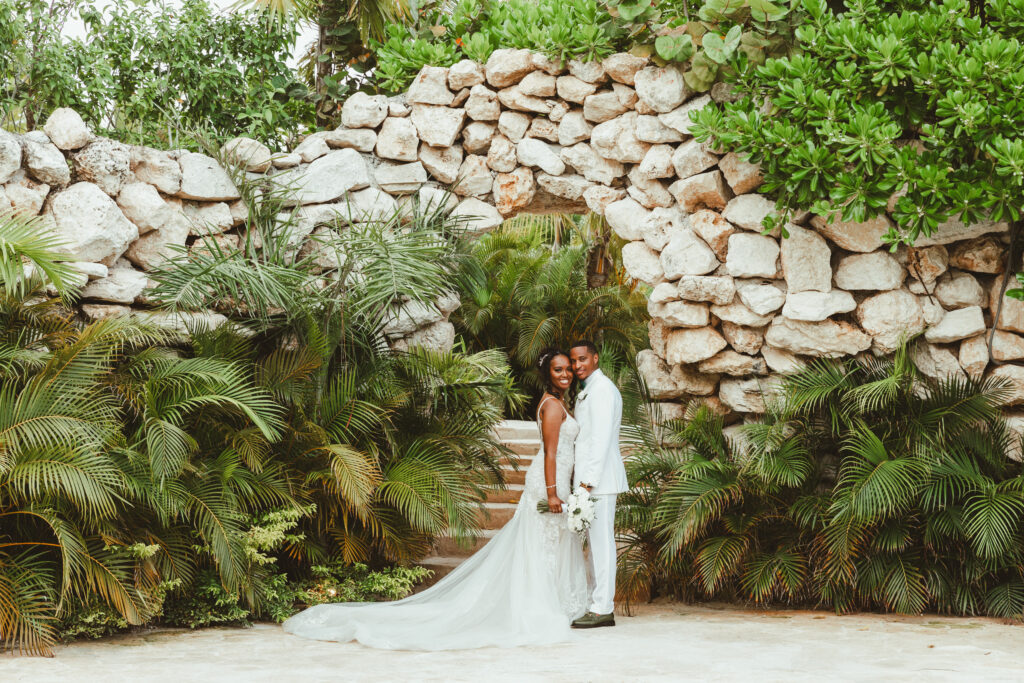 Destination wedding bride & groom in  Mexico tropical setting