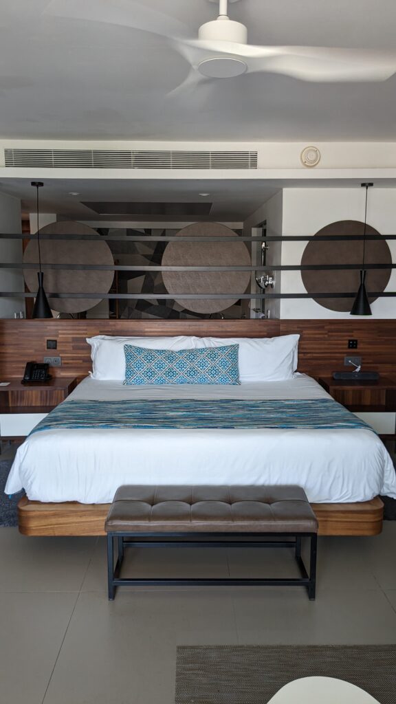 King bed at Majestic Elegance Costa Mujeres 