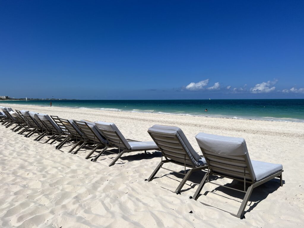 costa mujeres is a wide, white sandy beach with blue water