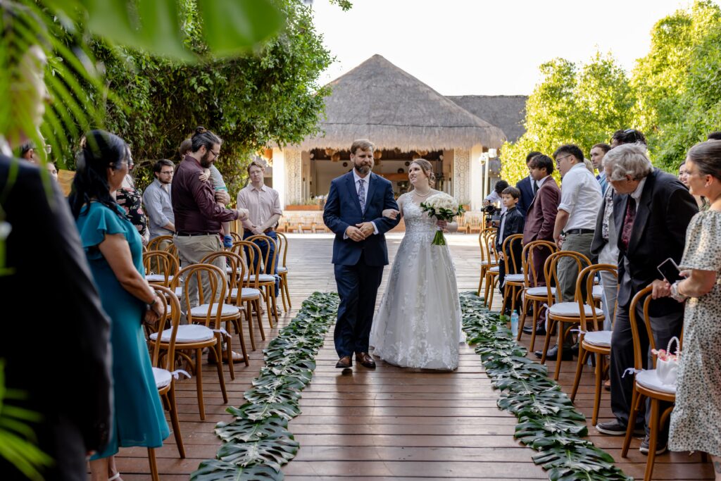 ivey walks down the aisle of her destination wedding