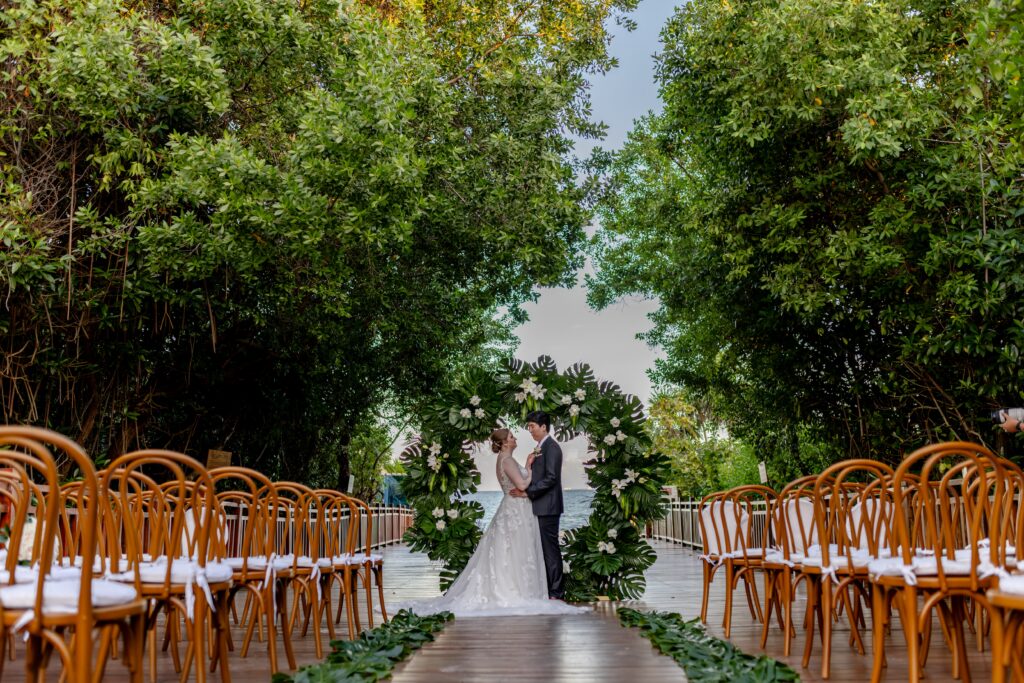the couple shares a sweet moment at paradisus playa del carmen